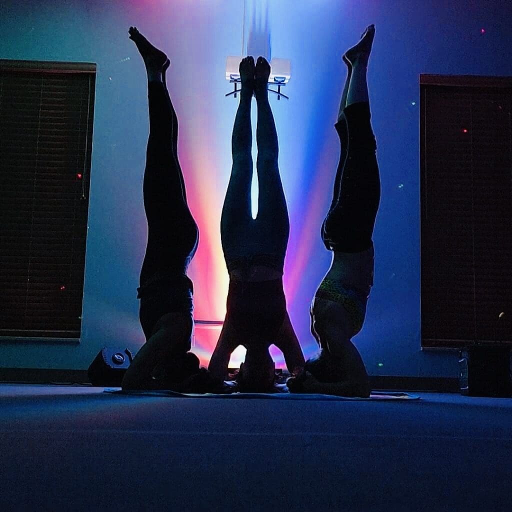 Three women are doing yoga